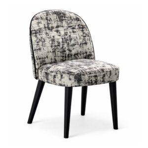 Carmen Side Chair with black wooden legs and a curved, white and black textured upholstered seat and backrest.