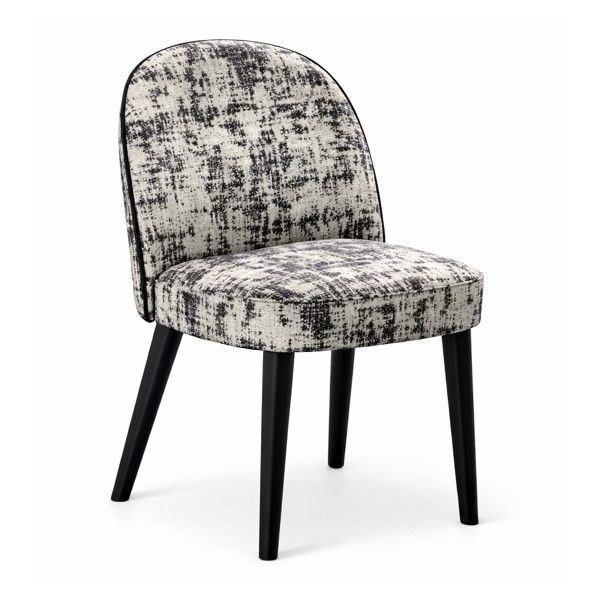 Carmen Side Chair with black wooden legs and a curved, white and black textured upholstered seat and backrest.