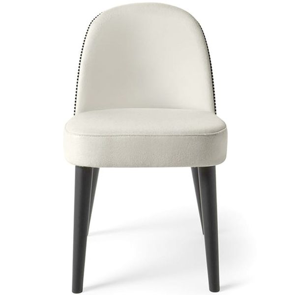 Front view of the Carmen Side Chair, showcasing an elegant cream upholstered seat and dark tapered wooden legs.