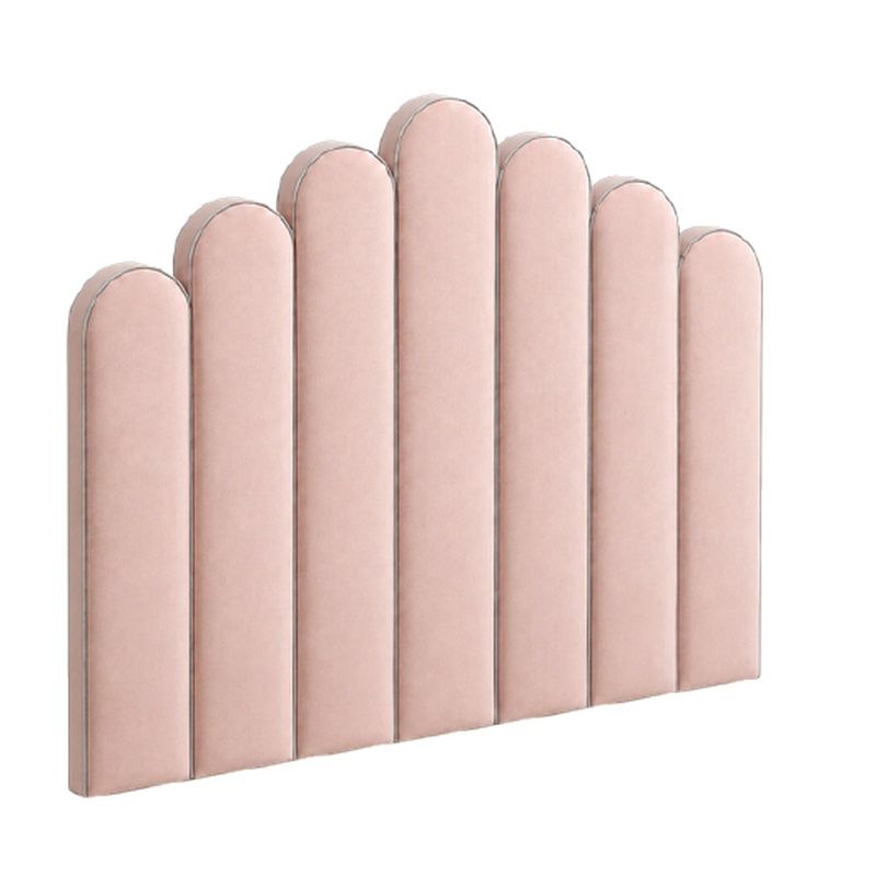 Close-up angled view of the Juniper Small Single Headboard featuring vertical pale pink velvet slats and rounded tops.