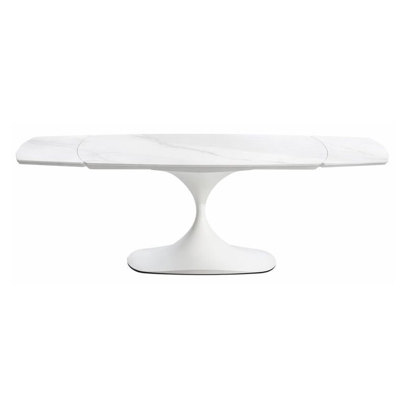 Studio shot of the Leo Extendable Dining Table showcasing its white marble-patterned surface and pedestaled metal base.