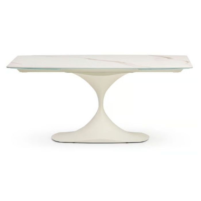Leo Extendable Dining Table with a white marble-look ceramic top and a sculptural white pedestal metal base.