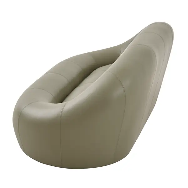 High-angle perspective of the Loop Sofa, highlighting its sculptural, teardrop-shaped silhouette and sage leather skin.