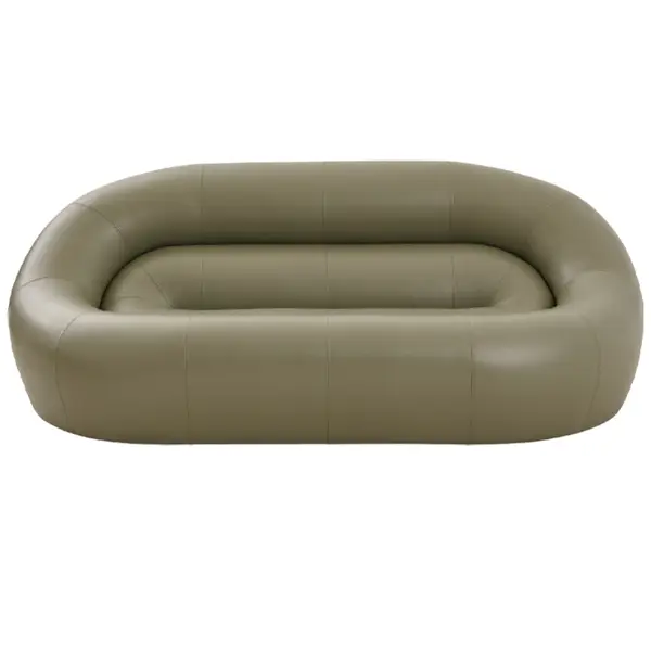 Studio shot of the Loop Sofa, presenting a symmetrical, oblong frame upholstered in a monochromatic sage green finish.
