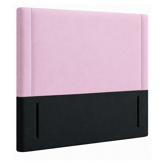 Close-up perspective of a Divan King headboard featuring a two-tone design with soft pink upholstery over a black base.