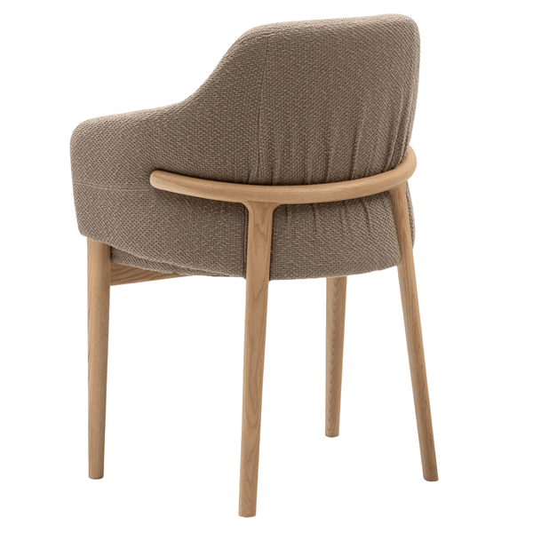 Rear view of the Trench Armchair, highlighting its curved light wood frame and textured beige fabric upholstery.