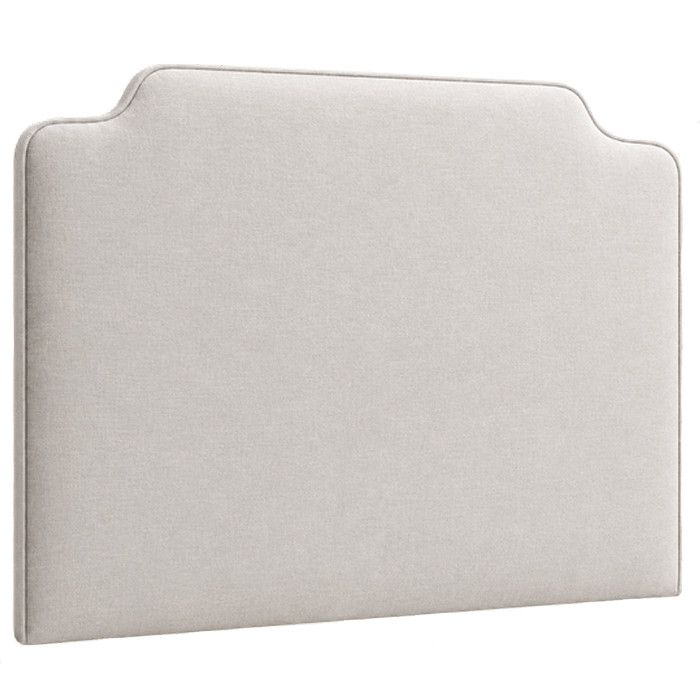 Vaughan Super King headboard in beige fabric with a clean, contemporary curved top edge, seen from a side-angle view.