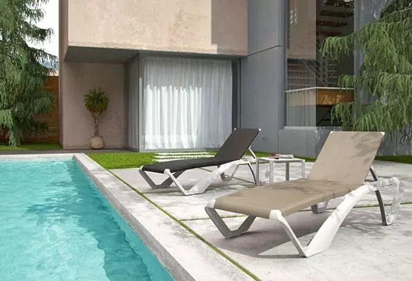 Two Aqua sun loungers on a pool deck, showcasing a modern white frame design with contrasting black and beige mesh seats.
