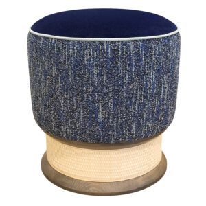 Contemporary Mira low stool featuring a blue velvet top, textured navy fabric sides, and a woven cane pedestal base.