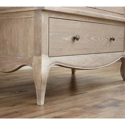 Close-up of the Cameo wardrobe showing the light wood grain texture, curved apron, and elegant cabriole legs.