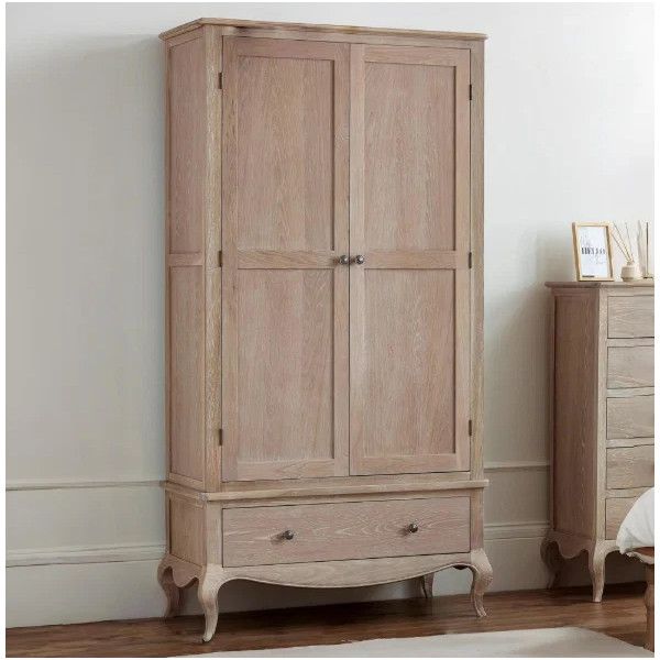 Cameo wardrobe in a natural pine finish, showcasing a tall two-door hanging section above a spacious single base drawer.