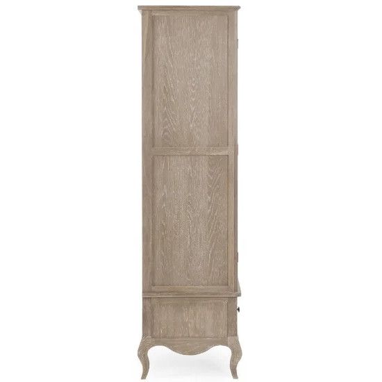 Side profile view of the Cameo wardrobe, displaying its slender wooden frame, intricate grain, and ornate cabriole legs.