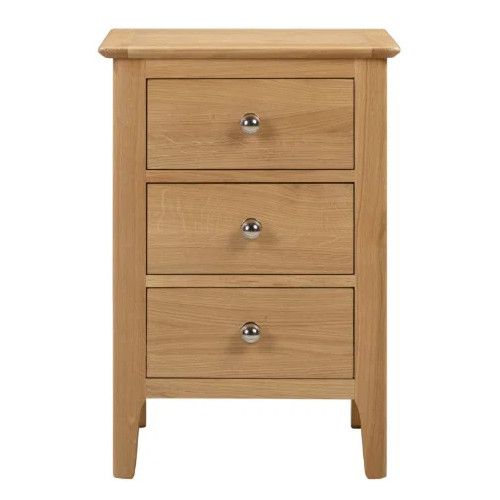 Front view of the Cotswold Bedside unit, featuring three drawers with metallic handles in a warm, light oak grain finish.