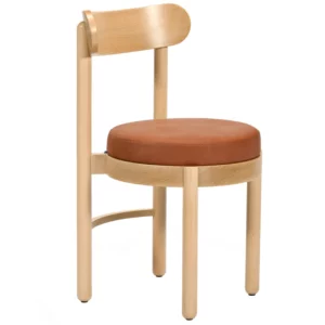 Three-quarter view of the Doris Side Chair featuring a minimalist light wood frame and a padded, circular leather seat.