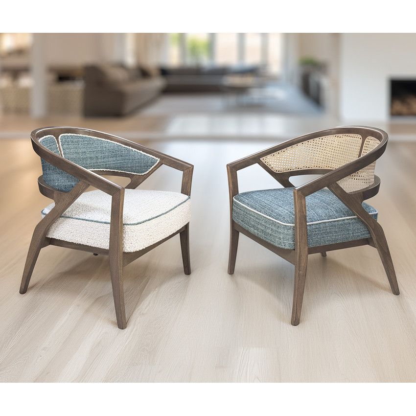 Two Florence Cane Lounge Chairs displayed together with contrasting blue and white textured fabric cushions.