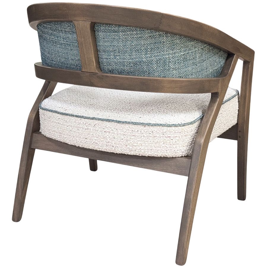 Rear view of the Florence lounge chair, showcasing its dark wood frame and patterned blue and cream upholstered back.