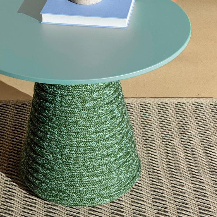 High-angle view of the Ikon Twist table base with green woven rope, supporting a smooth tabletop holding a blue book.