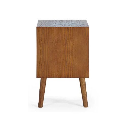 Profile side view of the solid oak Lowry bedside table, showcasing its clean wooden structure and sturdy four-legged base.