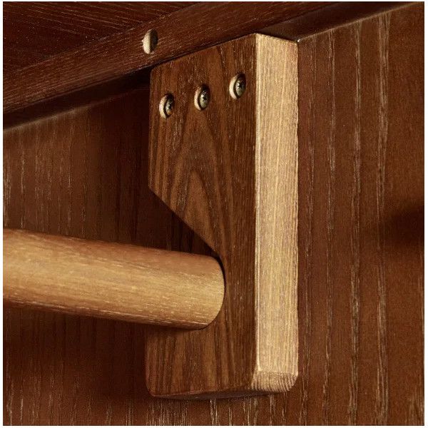 Detailed view of the Lowry wardrobe interior focusing on the sturdy wooden hanging rail bracket and its screw fixation.