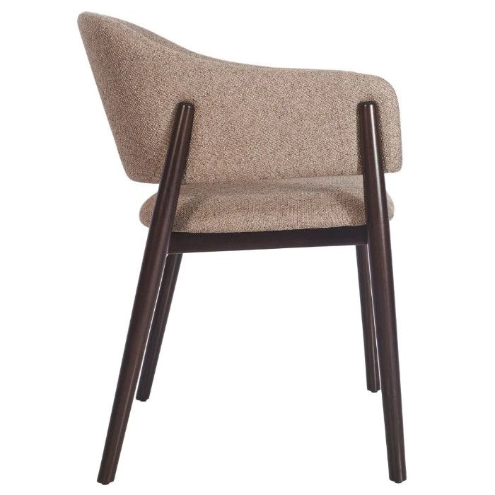 Profile view of the Milo Armchair showing the curved silhouette, dark wood legs, and textured brown upholstered seat.