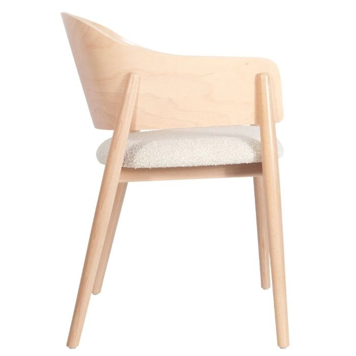 Profile view of the Milo W Armchair, highlighting its sleek wooden frame, integrated armrests, and padded seat.