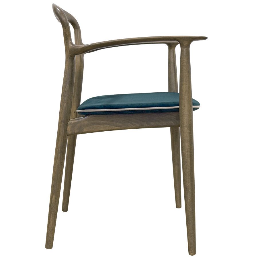 Verona Armchair shown in profile featuring a light timber frame and dark teal upholstered seat pad.