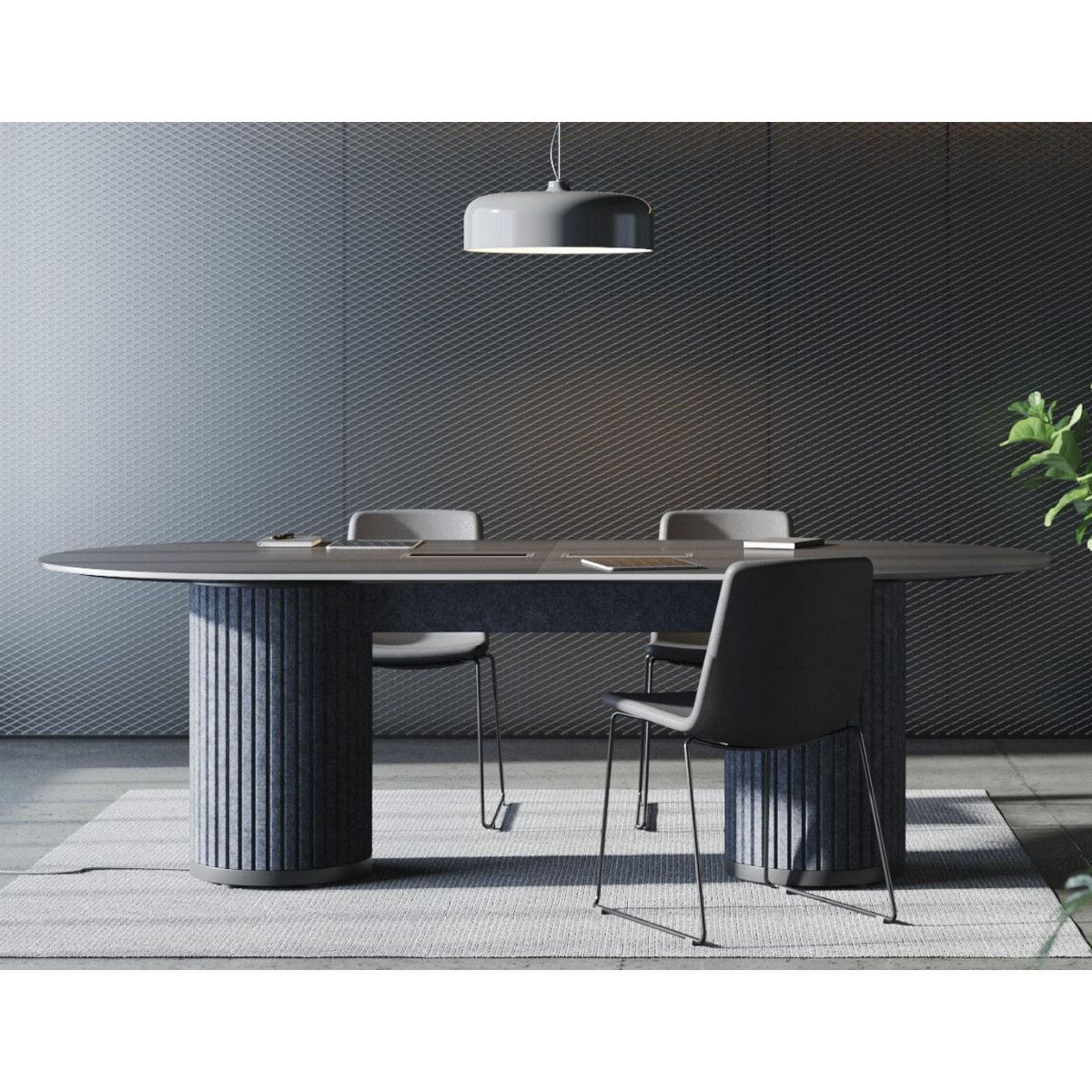 Parthos small meeting table featuring a dark oval top and two blue fluted pedestals, set in a modern office interior.