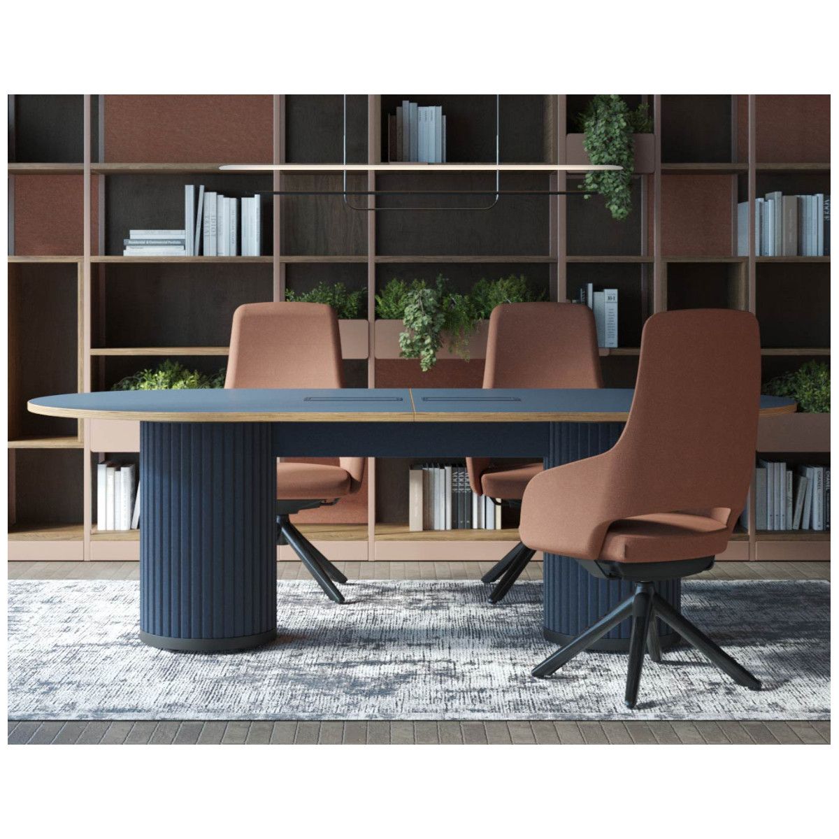 Parthos small meeting table featuring a deep blue oval surface and twin fluted pedestals, flanked by rust-toned chairs.