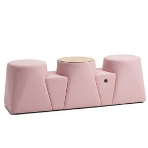 Ada Linear Pouf in pink upholstery with sculpted seat and round wooden table top