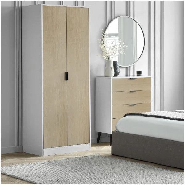 Alba wardrobe featuring a dual-tone white and light oak finish, positioned in a bedroom next to a matching chest.