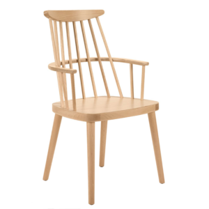 Light wood Bam W Armchair with spindle back and curved arms, angled view on white background.