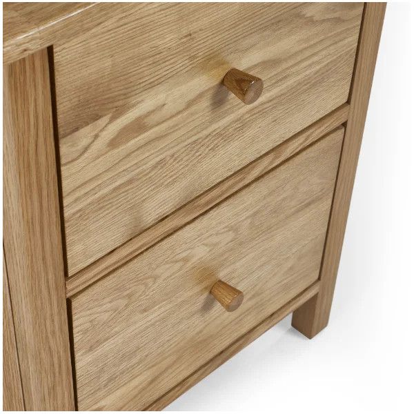Close-up view of the Coxmoor 2 drawer bedside, showcasing the wood grain detail and tapered round handles on each drawer.