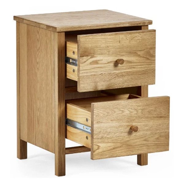Angled view of the Coxmoor 2 drawer bedside table with both wooden drawers pulled open to reveal metal runners.