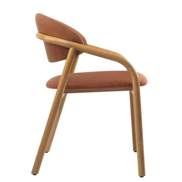 Side profile of the Elia Armchair, highlighting its curved timber frame and upholstered seat against a white background.