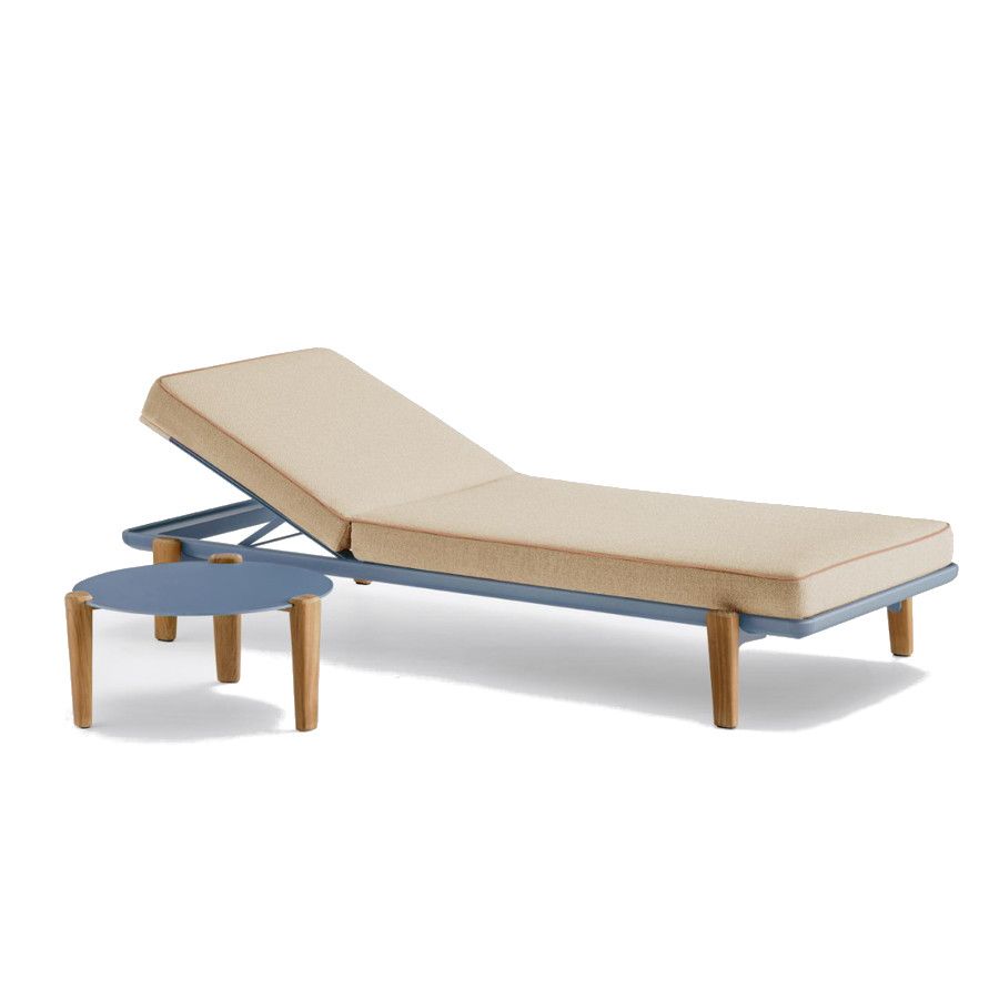 Blue metal Fibra Sun Lounger and matching side table with beige cushions and wooden legs, isolated on white background.