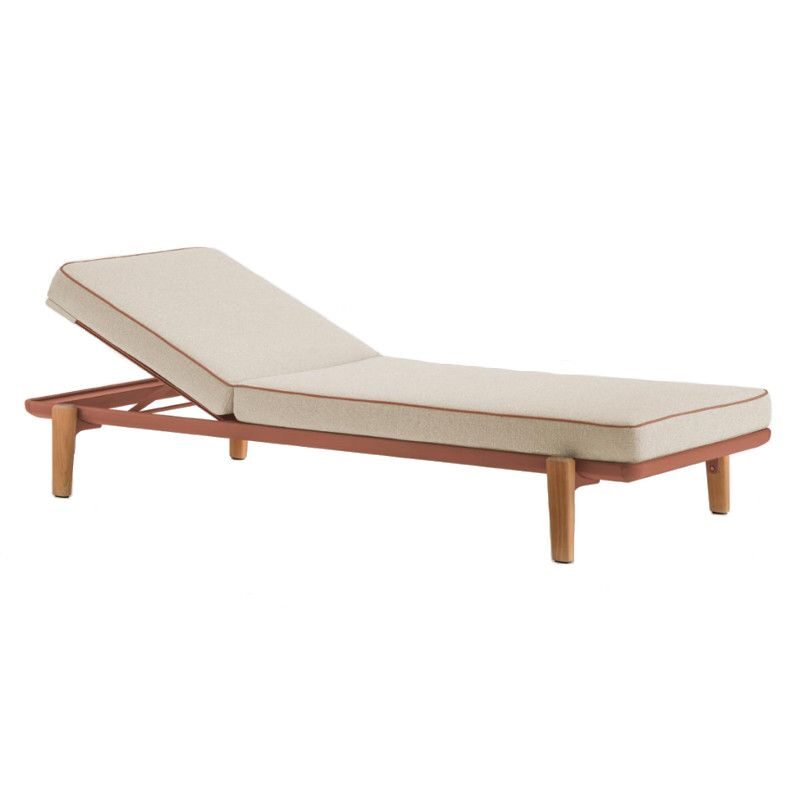 Fibra Sun Lounger featuring a terracotta metal frame, beige upholstered cushion, and light timber legs, angled view.