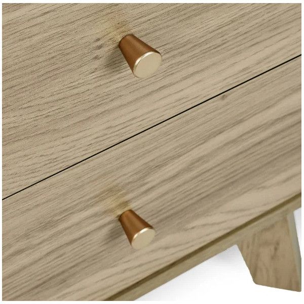 Close-up of the Ingrid bedside drawers highlighting the light wood grain texture and conical metallic hardware knobs.