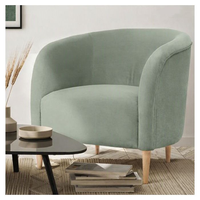 Sage green Larens lounge chair featuring a curved upholstered silhouette and natural wooden tapered legs.