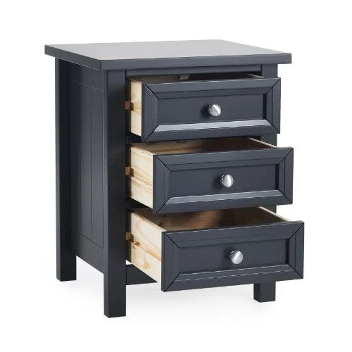 Dark grey Maine bedside table showing three fully extended drawers with natural wooden interiors and silver hardware.