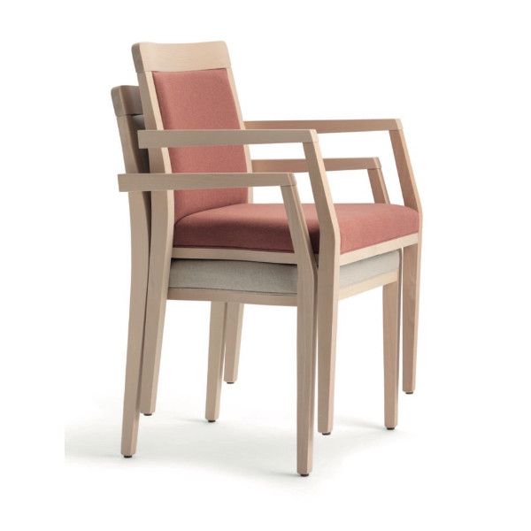 Side angle view of two stacked Opera side chairs showing light wood frames and coral upholstery on white background.