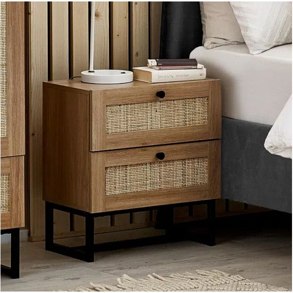 Natural oak Padstow bedside table featuring two rattan-fronted drawers and a minimalist black metal sled base.