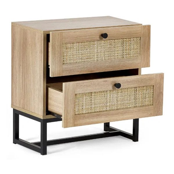 Padstow bedside table with light oak finish, showing two open drawers with woven rattan panels and black knob handles.