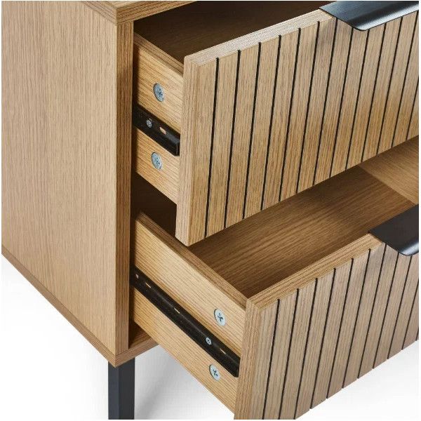 Close-up view of the Sia bedside unit showing two open wooden drawers with textured slatted fronts and black pulls.