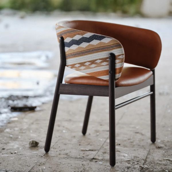Upholstered Camille S side chair back view with patterned fabric panel and tan leather seat on dark wood legs
