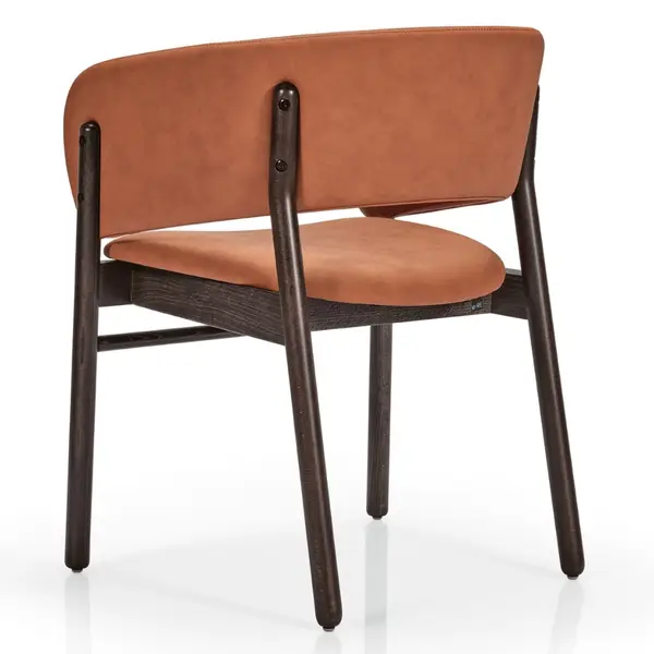 Camille S side chair angled rear view showing tan upholstered seat and backrest on a dark stained wooden four-leg frame