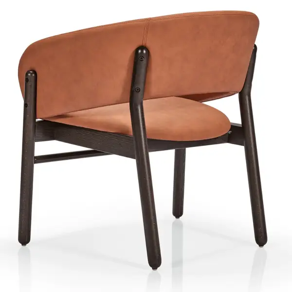Back view of the Camille S Lounge Chair with a tan leather upholstered seat and backrest on a dark wooden four-legged frame