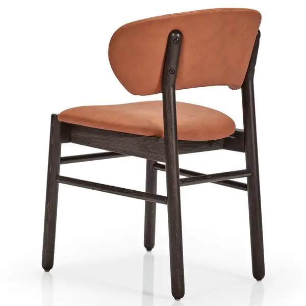 Rear view of the Camille S Side Chair showing tan leather seat and curved backrest with visible dark wood frame fixings