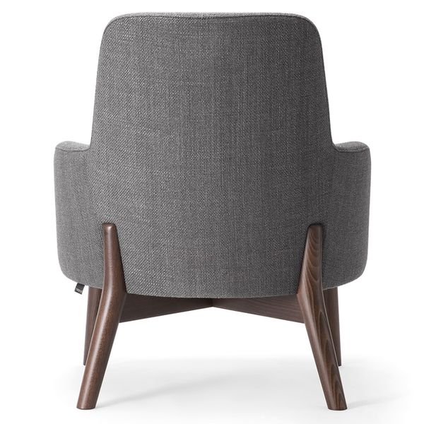 Rear view of the Celine Lounge Chair showing grey upholstered back, armrests and splayed wooden legs